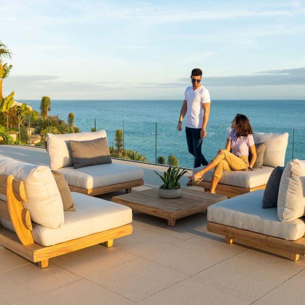 A modular outdoor lounge arranged with space to move beneath a pergola
